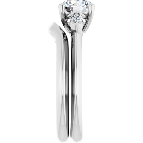 This 3 stone engagement ring set features a classic-meets-modern design, centered around a brilliant 6.5mm round-cut lab diamond. On either side, two accent stones enhance the sparkle, providing a balanced and meaningful composition. Even better, the curved wedding band aligns effortlessly with the engagement ring, creating a graceful and secure fit. As a result, this design not only captures elegance but also ensures comfort for daily wear. Additionally, the refined dimensions—approx. 7.5 x 2.9 mm top profile and 10.03g in total weight—make it feel substantial yet wearable.