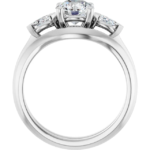 This 3 stone engagement ring set features a classic-meets-modern design, centered around a brilliant 6.5mm round-cut lab diamond. On either side, two accent stones enhance the sparkle, providing a balanced and meaningful composition. Even better, the curved wedding band aligns effortlessly with the engagement ring, creating a graceful and secure fit. As a result, this design not only captures elegance but also ensures comfort for daily wear. Additionally, the refined dimensions—approx. 7.5 x 2.9 mm top profile and 10.03g in total weight—make it feel substantial yet wearable.