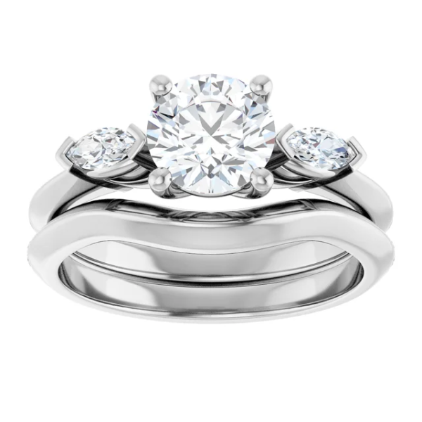 This 3 stone engagement ring set features a classic-meets-modern design, centered around a brilliant 6.5mm round-cut lab diamond. On either side, two accent stones enhance the sparkle, providing a balanced and meaningful composition. Even better, the curved wedding band aligns effortlessly with the engagement ring, creating a graceful and secure fit. As a result, this design not only captures elegance but also ensures comfort for daily wear. Additionally, the refined dimensions—approx. 7.5 x 2.9 mm top profile and 10.03g in total weight—make it feel substantial yet wearable.