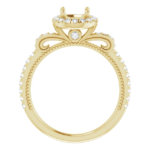 This vintage halo engagement ring setting is designed to hold a 6.5mm round center stone. Featuring intricate scrollwork details and a pave diamond band, this elegant mounting is available in 18K gold. Ideal for custom engagement jewelry.