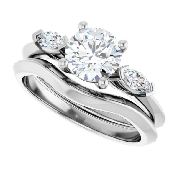 This 3 stone engagement ring set features a classic-meets-modern design, centered around a brilliant 6.5mm round-cut lab diamond. On either side, two accent stones enhance the sparkle, providing a balanced and meaningful composition. Even better, the curved wedding band aligns effortlessly with the engagement ring, creating a graceful and secure fit. As a result, this design not only captures elegance but also ensures comfort for daily wear. Additionally, the refined dimensions—approx. 7.5 x 2.9 mm top profile and 10.03g in total weight—make it feel substantial yet wearable.