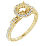 This vintage halo engagement ring setting is designed to hold a 6.5mm round center stone. Featuring intricate scrollwork details and a pave diamond band, this elegant mounting is available in 18K gold. Ideal for custom engagement jewelry.
