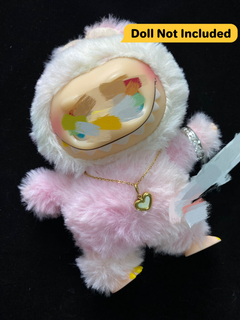 This heart toy necklace features a polished, stainless steel heart pendant crafted in a compact scale suitable for collectible toys, plush dolls, and mini displays. The clean silhouette and soft curves evoke a playful spirit, while the chain length is tailored to match your figure's scale perfectly.