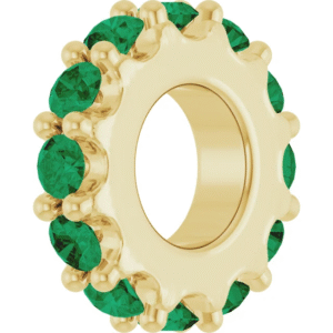 This 2.0mm lab emerald eternity band adds a pop of vivid color to your fine jewelry collection. Each lab-grown emerald sparkles with rich green hues and is precisely set in a full circle, ensuring that elegance radiates from every angle. Although delicate in width, this ring offers undeniable presence when worn alone or as part of a stylish stack.