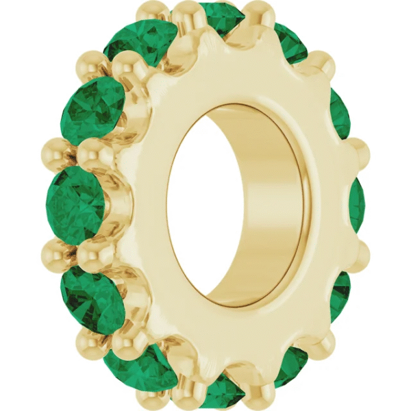 This 2.0mm lab emerald eternity band adds a pop of vivid color to your fine jewelry collection. Each lab-grown emerald sparkles with rich green hues and is precisely set in a full circle, ensuring that elegance radiates from every angle. Although delicate in width, this ring offers undeniable presence when worn alone or as part of a stylish stack.