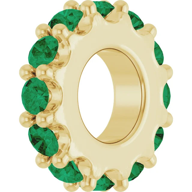This 2.0mm lab emerald eternity band adds a pop of vivid color to your fine jewelry collection. Each lab-grown emerald sparkles with rich green hues and is precisely set in a full circle, ensuring that elegance radiates from every angle. Although delicate in width, this ring offers undeniable presence when worn alone or as part of a stylish stack.