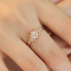 This princess cut lab diamond cluster engagement ring masterfully blends modern elegance with classic sophistication. In addition, as a made-to-order engagement jewelry piece, it offers you the flexibility to customize the arrangement of lab-grown diamonds to match your taste. Whether you prefer a minimalist cluster or a more intricate design, we collaborate closely with you throughout the process, so that the final piece truly becomes personalized fine jewelry tailored to your vision and lifestyle.