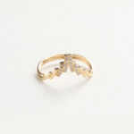 This chevron-shaped wedding band features clean lines and delicate curves, designed to complement both solitaire and three-stone engagement rings. Paved with lab-grown diamonds, it combines ethical luxury with modern aesthetics. We offer various metal options such as 925 sterling silver, 9K/10K/14K/18K gold, and PT950 platinum. You can also customize the stone type—including cubic zirconia, moissanite, lab-grown diamonds, natural diamonds, and colored gemstones. Personal engravings or symbolic patterns are available on request. If you have a specific design in mind, feel free to send us your sketches—we're happy to turn your vision into a one-of-a-kind custom fine jewelry piece with the help of our professional design team.