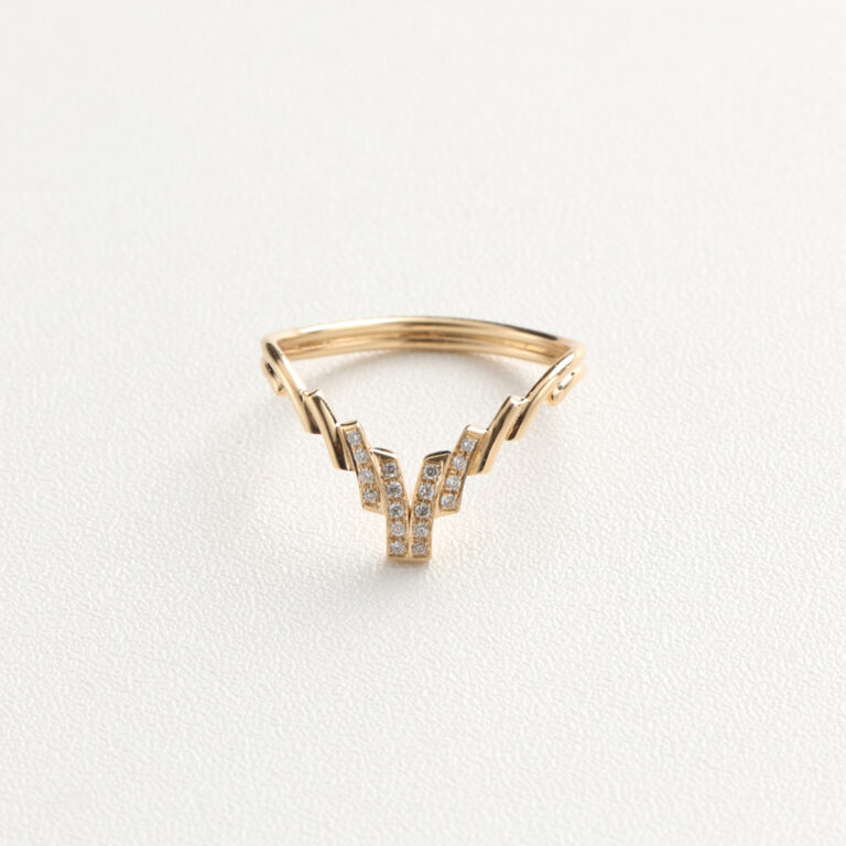 This chevron-shaped wedding band features clean lines and delicate curves, designed to complement both solitaire and three-stone engagement rings. Paved with lab-grown diamonds, it combines ethical luxury with modern aesthetics. We offer various metal options such as 925 sterling silver, 9K/10K/14K/18K gold, and PT950 platinum. You can also customize the stone type—including cubic zirconia, moissanite, lab-grown diamonds, natural diamonds, and colored gemstones. Personal engravings or symbolic patterns are available on request. If you have a specific design in mind, feel free to send us your sketches—we're happy to turn your vision into a one-of-a-kind custom fine jewelry piece with the help of our professional design team.