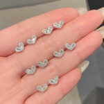 Shop custom heart moissanite earrings with 1pc MOQ. Perfect minimalist engagement fine jewelry with premium brilliance and fully personalized design options.