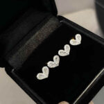 Shop custom heart moissanite earrings with 1pc MOQ. Perfect minimalist engagement fine jewelry with premium brilliance and fully personalized design options.
