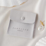 This custom logo jewelry pouch is created for jewelry brands, designers, and studios seeking dependable packaging solutions. It supports both small-batch and bulk orders, making it suitable for emerging brands as well as established businesses. Whether used as a primary packaging piece or as inner protection within a jewelry box, the pouch offers reliable storage and polished presentation. Its secure closure, refined texture, and customization flexibility make it a practical choice for long-term jewelry packaging strategies.