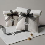 This custom logo jewelry pouch is a practical packaging solution designed for jewelry brands that value simplicity, consistency, and everyday usability. Made from soft cotton fabric, it provides a clean and reliable way to store and protect jewelry pieces such as rings, earrings, bracelets, and necklaces. Rather than acting as decorative packaging, this pouch focuses on function, brand clarity, and efficient order fulfillment across retail and online channels.