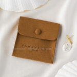 This custom logo jewelry pouch is created for jewelry brands, designers, and studios seeking dependable packaging solutions. It supports both small-batch and bulk orders, making it suitable for emerging brands as well as established businesses. Whether used as a primary packaging piece or as inner protection within a jewelry box, the pouch offers reliable storage and polished presentation. Its secure closure, refined texture, and customization flexibility make it a practical choice for long-term jewelry packaging strategies.