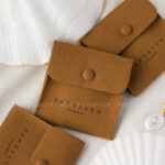 This custom logo jewelry pouch is created for jewelry brands, designers, and studios seeking dependable packaging solutions. It supports both small-batch and bulk orders, making it suitable for emerging brands as well as established businesses. Whether used as a primary packaging piece or as inner protection within a jewelry box, the pouch offers reliable storage and polished presentation. Its secure closure, refined texture, and customization flexibility make it a practical choice for long-term jewelry packaging strategies.