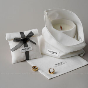 This custom logo jewelry pouch is a practical packaging solution designed for jewelry brands that value simplicity, consistency, and everyday usability. Made from soft cotton fabric, it provides a clean and reliable way to store and protect jewelry pieces such as rings, earrings, bracelets, and necklaces. Rather than acting as decorative packaging, this pouch focuses on function, brand clarity, and efficient order fulfillment across retail and online channels.