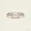 An east west engagement ring rotates the center stone so it sits horizontally across the finger instead of vertically. It works beautifully with elongated shapes (oval, marquise, emerald, radiant, antique cushion), and it often looks “designed” rather than “default.”