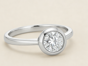 A bezel set engagement ring offers a sleek profile and extra security. Learn options, metals, timelines, and FAQs for custom fine jewelry.