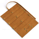 Custom microfiber jewelry roll made from soft suede. It is designed for jewelry brands seeking compact, multi-functional, and professional travel packaging solutions.