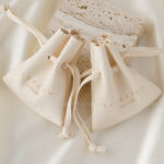 Custom microfiber ingot pouch made from light-colored soft suede. It is designed for jewelry brands seeking unique, professional, and protective packaging solutions with a 100-piece MOQ.