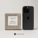 The envelope construction provides a flat and organized format that keeps jewelry neatly contained. Its structured shape allows for easy stacking and storage, making it suitable for both small accessories and fine jewelry pieces. The linen label element adds a subtle textural contrast without overpowering the design, ensuring the jewelry remains the visual focus. The overall aesthetic is understated and adaptable to various brand styles.