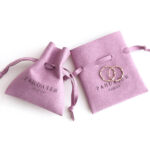 This custom microfiber ingot pouch features a unique ingot shape. It provides a soft, elegant, and secure storage solution for professional jewelry branding with a 100pc MOQ.