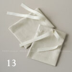 This custom ribbon jewelry pouch features a soft bow and a silk-like feel. It provides a sweet and secure solution for jewelry branding.