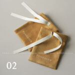 This custom ribbon jewelry pouch features a soft bow and a silk-like feel. It provides a sweet and secure solution for jewelry branding.