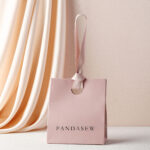 This custom colorful jewelry bag features a portable handle and a vibrant finish. It provides a secure and elegant storage solution for jewelry.