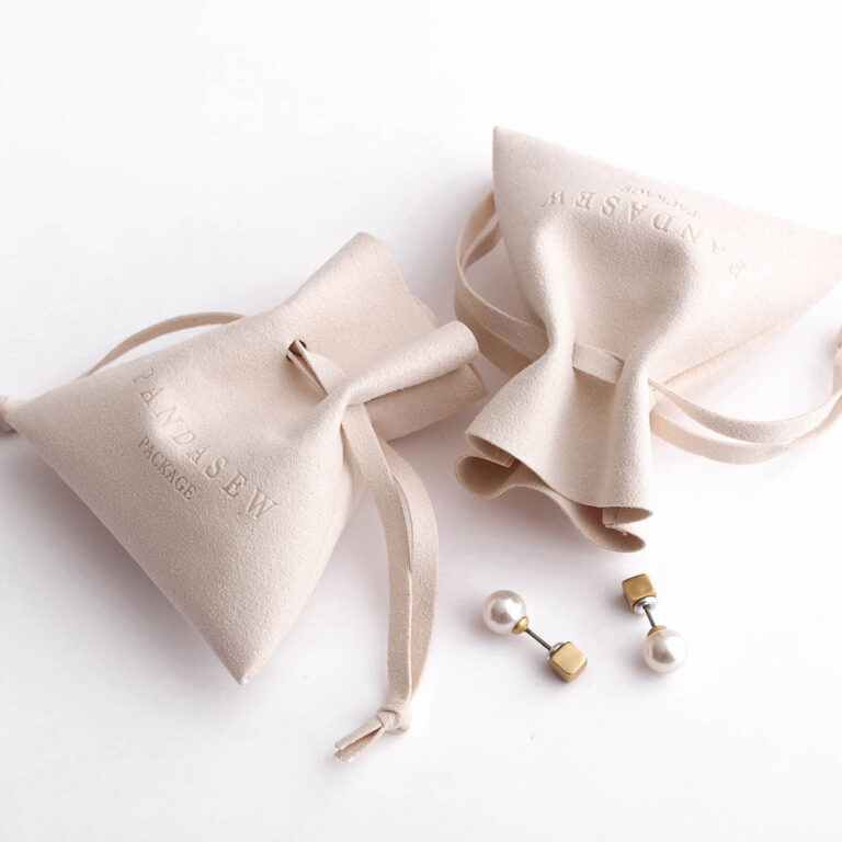 This custom microfiber ingot pouch features a unique ingot shape. It provides a soft, elegant, and secure storage solution for professional jewelry branding with a 100pc MOQ.