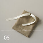 This custom ribbon jewelry pouch features a soft bow and a silk-like feel. It provides a sweet and secure solution for jewelry branding.