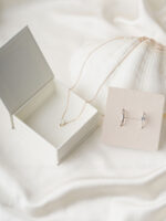 This custom book jewelry box features a unique book shape and a magnetic closure. It provides a secure and elegant solution for jewelry branding.