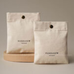 The design features a classic rectangular silhouette. It includes a reinforced snap button closure. Therefore, the jewelry stays in place without any risk of slipping out. The cotton canvas material is selected for its breathability. Additionally, the soft inner surface helps prevent scratches on delicate metal finishes. Its compact size makes it an ideal companion for travel. Moreover, it maintains a professional appearance that aligns with modern branding standards. The tactile experience of the canvas adds a layer of quality to your presentation.