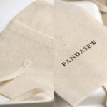 This custom cotton envelope pouch features a unique string tie and soft fabric. It provides a natural and secure solution for jewelry branding.This custom cotton envelope pouch features a unique string tie and soft fabric. It provides a natural and secure solution for jewelry branding.