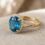 private label 10K yellow gold blue topaz engagement ring supplier — custom jewelry manufacturing photo 1