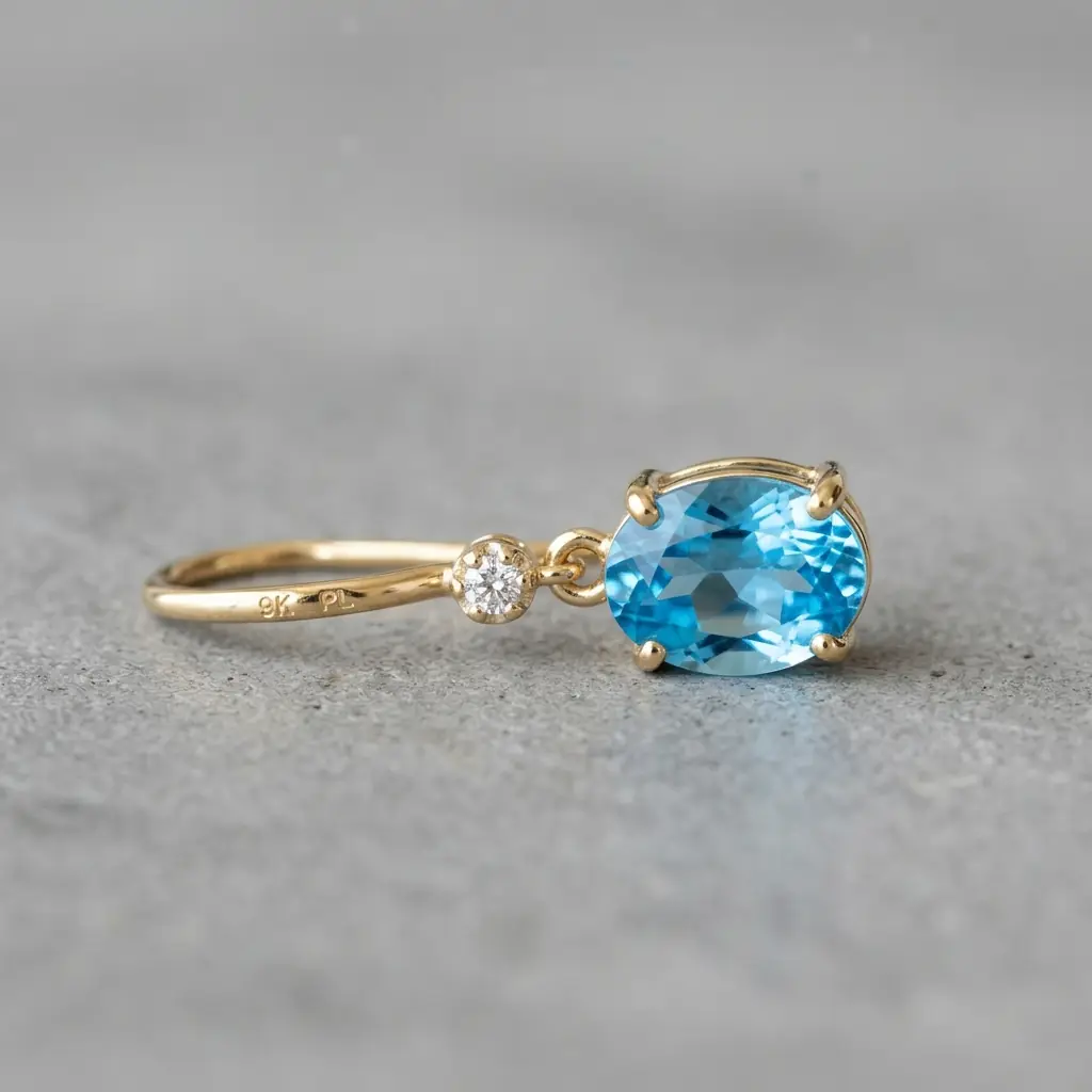 private label 9K yellow gold blue topaz earring supplier — custom jewelry manufacturing photo 1