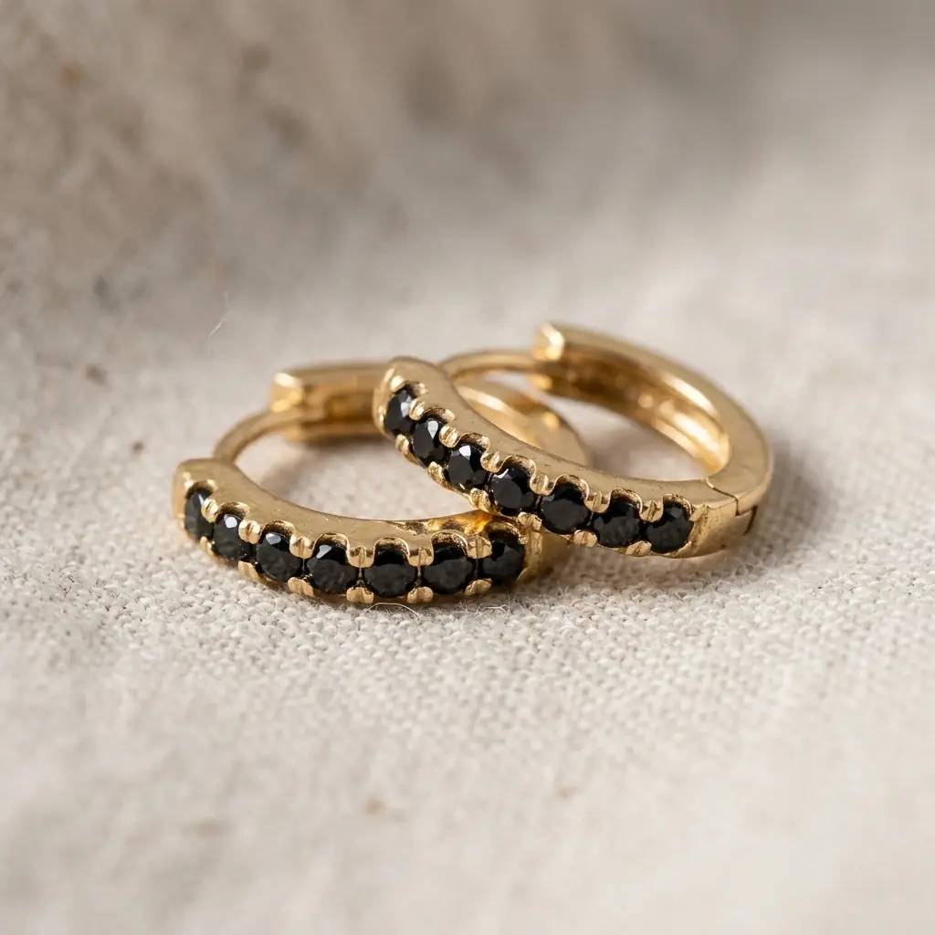 OEM 9K yellow gold black spinel huggie earrings manufacturer — custom jewelry manufacturing photo 1