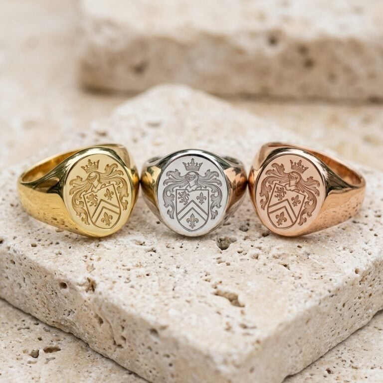 Hand-engraved family crest signet rings in yellow, white and rose gold