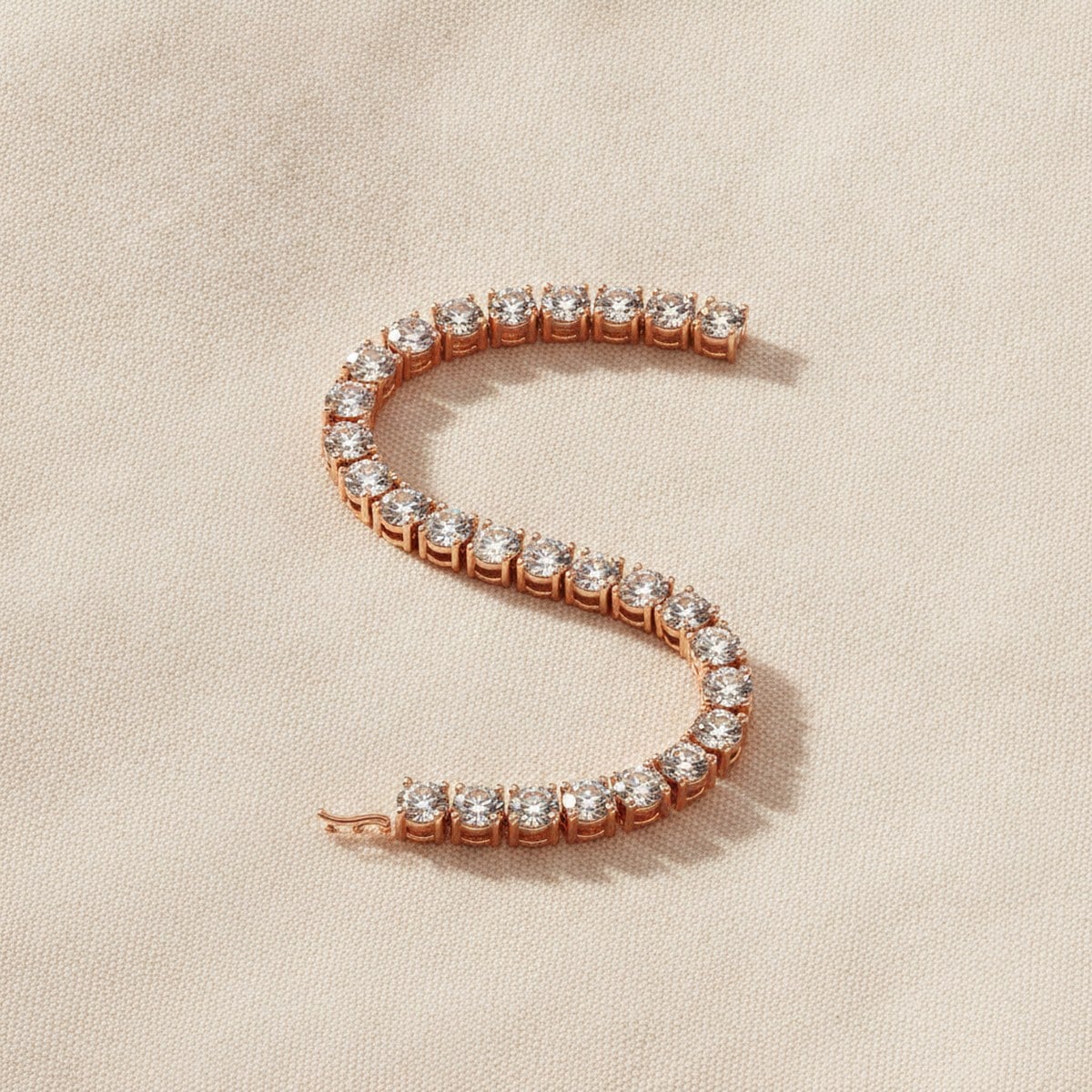 Rose-gold diamond tennis bracelet on linen — Alpha Jewelry OEM